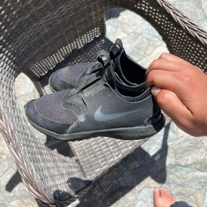 Black slip on Nike kids shoes
